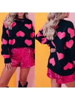 Pull noir avec détails rose