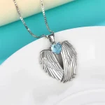 accessoire coeur bleu avec ailes