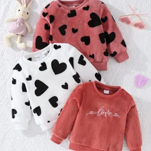 Trois pulls coeur fausse fourrure