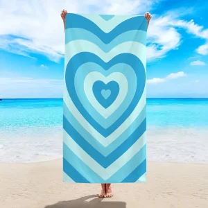 Jolie serviette de plage noire coeurs supperposés